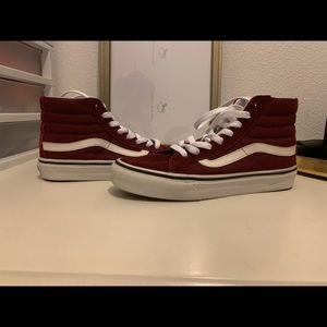 Woman’s Hightop Maroon Vans.
